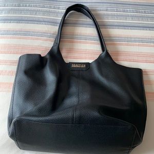 Reaction Kenneth Cole black tote/purse, it is very spacious!